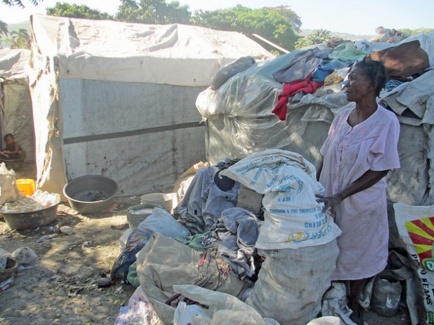 Mimose Gérard, 57, washes clothes and collects plastic bottles from the trash in order to survive. She is still living in a tent camp four years after Haiti's earthquake. Credit: Milo Milfort/IPS