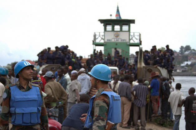 National police arrive on a boat at Goma's port in DRC as U.N. peacekeepers look on. Credit: William Lloyd-George/IPS
