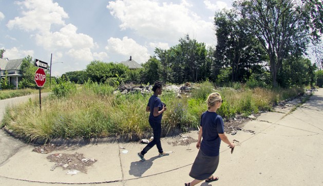 Jasmine Omeke and Mariel Borgman of the University of Michigan survey an abandoned lot on the east side of Detroit. Unpaid bills are often converted to liens against properties. Credit: University of Michigan School of Natural Resources and Environment/cc by 2.0