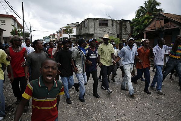 Protesters march through Port-au-Prince in April 2008 to demand the government lower the price of basic commodities.  Credit: Nick Whalen/IPS