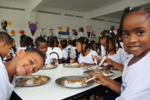 Children having a daily lunch meal at a kindergarten in a poor community in Salvador, Bahia. Brazil's National School Feeding Programme is an example of one of the far-reaching programmes implemented in line with the Millennium Development Goals (MDGs). Credit: Carolina Montenegro/WFP