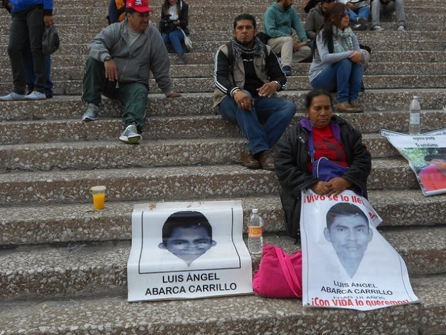 Metodia Carrillo, a member of the Nahuatl indigenous community, holds a sign with the picture of her son LuÃƒÂ­s ÃƒÂngel Abarca, one of the 43 students who went missing Sep. 26 in Iguala, as she rests on the bleachers of the National Stadium during a protest by the studentsÃ¢Â€Â™ families in the Mexican capital, four months after they were kidnapped. Credit: Emilio Godoy/IPS