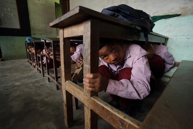 School children in Nepal’s Matatirtha village practice an earthquake drill in the event of a natural disaster. A 7.8-magnitude earthquake in Nepal on Apr. 25, 2015, has endangered the lives of close to a million children. Credit: Department of Foreign Affairs and Trade/CC-BY-2.0