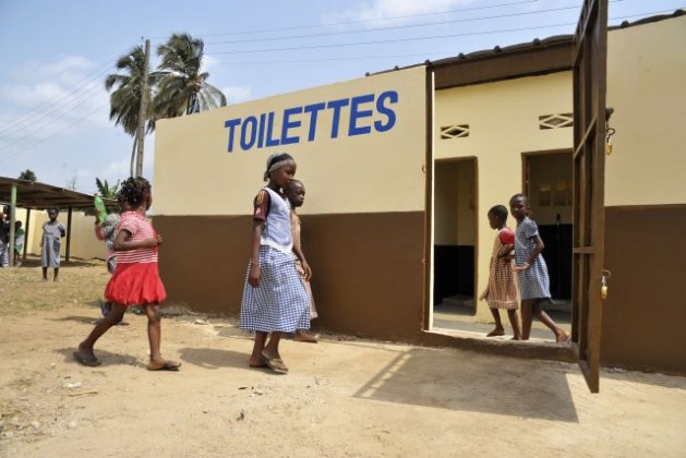 Children investigate their community's newly improved toilets, one of UNOCI's Ã¢Â€Âœquick impact projectsÃ¢Â€Â (QIPS) which supported the rehabilitation of schools and toilets in Abidjan. Credit: UN Photo/Patricia Esteve