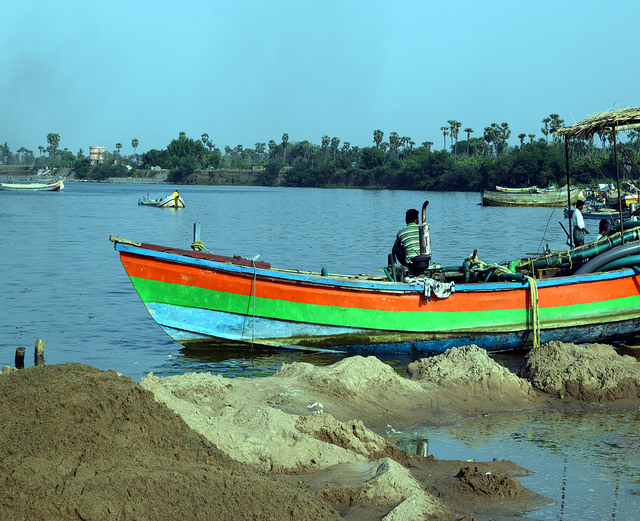 These illegal sand mining boats in India’s populous Andhra Pradesh state are becoming a rare sight after women’s self-groups took over mining operations last year. Credit: Stella Paul