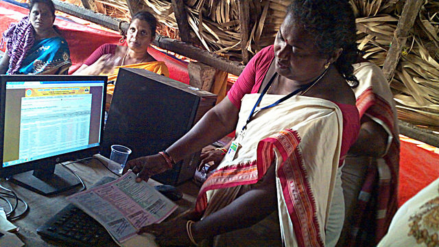 Rural women who have taken over sand mining operations in the southeastern Indian state of Andhra Pradesh are learning to use computers for the first time. Credit: Stella Paul/IPS