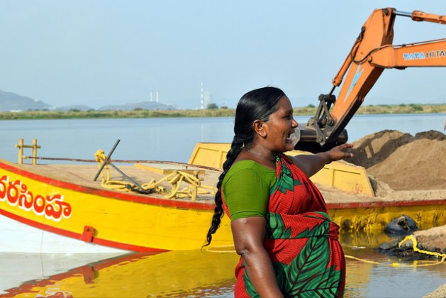 At dawn women miners gather at allocated sites along riverbanks in India’s coastal Andhra Pradesh state to oversee the process of dredging, loading and shipping sand. Credit: Stella Paul/IPS