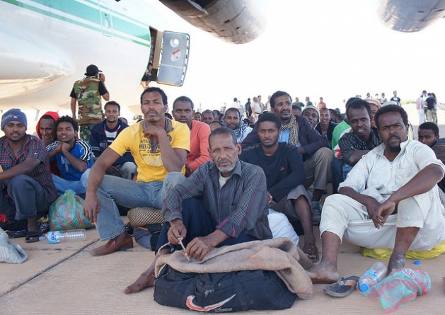 The migrants photographed here were being loaded on to a cargo plane in Kufra, located in southeastern Libya. Credit: Rebecca Murray/IPS