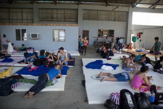 A group of Cubans wait in a shelter opened by the authorities in the town of La Cruz in the northwestern Costa Rican border province of Guanacaste. Credit: National Risk Prevention and Emergency Response Commission of Costa Rica