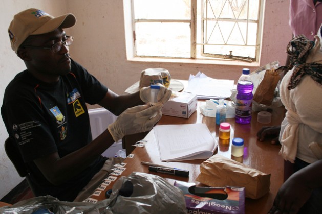 Laboratory Technician, Herbert Mtopa collects biological samples at a clinic in Zimbabwe's Shamva District under a CultiAF project to assess exposure of women and children to aflatoxins. Credit: Busani Bafana/IPS