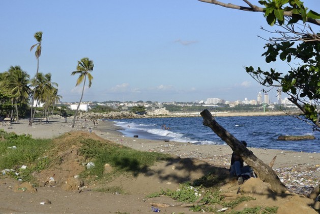 A view of Gringo beach and, in the background, the city of Bajos de Haina, the Dominican Republic’s main industrial hub and port, and the third-most polluted city in the world. Credit: Dionny Matos/IPS