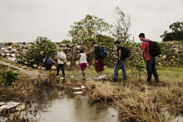 A group of Central American migrants walking along a trail in the southern Mexican state of Chiapas, on the border with Guatemala, at the start of their long journey across Mexico on their way to the United States. Credit: Courtesy Médecins Sans Frontières – Mexico