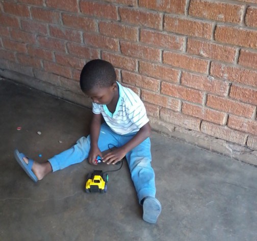 A small boy plays with his toys. Poor nutrition in Zimbabwe is exposing vulnerable children nutrition to mental health challenges according to humanitarian agencies. Credit: Ignatius Banda/IPS