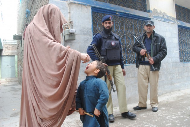 Families and health workers defy the Taliban's ban on oral polio vaccines (OPV). Credit: Ashfaq Yusufzai/IPS