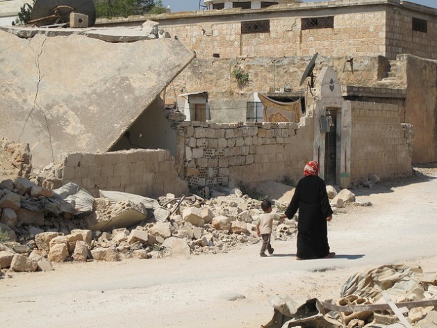 A Syrian mother and child near Ma'arat Al-Numan, rebel-held Syria, in autumn 2013.Credit: Shelly Kittleson/IPS.