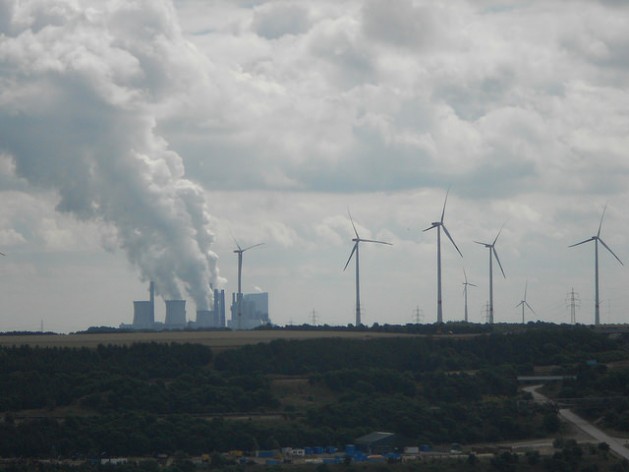 In Germany, wind and solar energy coexist with energy generated by burning fossil fuels. A wind farm next to one of the electric power plants fired by lignite in the Western state of North Rhine-Westphalia. Credit: Emilio Godoy/IPS