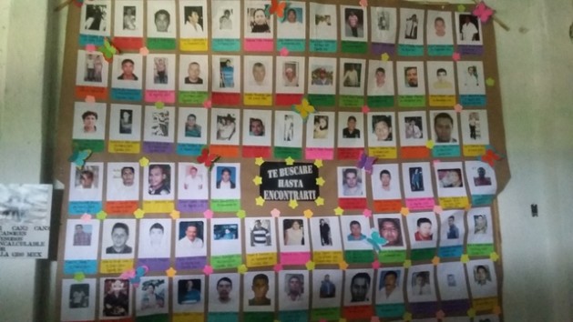 Signs with the images of victims of forced disappearance are becoming a common sight in Mexico, like this one in a church in Iguala in the southwestern state of Guerrero. Credit:  Daniela Pastrana/IPS