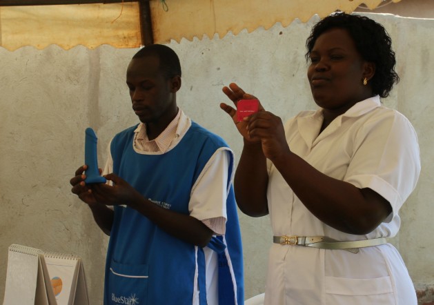 A nurse demonstrates how to use a condom at Christa Medical Clinic in Jinja, Uganda. Credit: Lyndal Rowlands/IPS.
