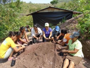 Members of a cooperative of women farmers in Nicaragua build a greenhouse for thousands of seedlings of fruit and lumber trees aimed at helping to fight the effects of climate change in a village in the department of Madriz. Credit: Femuprocan