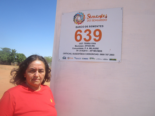 Antonia de Souza Oliveira in front of the seed bank in Milagre, a rural settlement of 28 families in the state of Rio Grande do Norte in Brazil, which has become famous for the strong participation of women in the village’s collective activities. Credit: Mario Osava/IPS