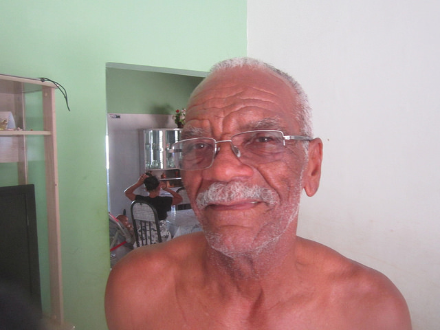 Retired fisherman and farmer 70-year-old Lourival de Barros, in his house in the town of Sento Sé, which he received as compensation for the loss of his nice house and other property in the old town, which was submerged by the Sobradinho dam four decades ago, whichburied a lifestyle that he still misses. Credit: Mario Osava/IPS
