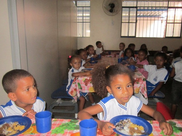Children eat lunch at a school in the state of Rio de Janeiro, Brazil, in a community where most children live in poverty, but thanks to the synergy between family farming and school meals, they have managed to eliminate malnutrition among the student body. Credit: Mario Osava/IPS