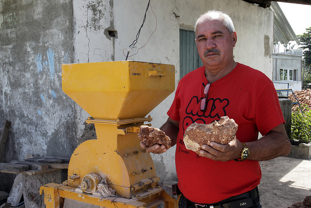 Rodolfo Frómeta, in charge of the local company that groups 12 small local factories of natural rocky materials and blocks, next to a stone mill, near the city of Baracoa in eastern Cuba. Credit: Jorge Luis Baños/IPS