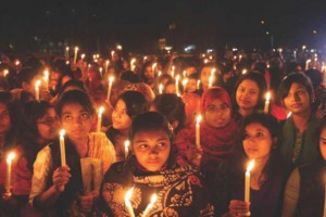 Women hold lit candles at midnight to mark International Women's Day last year. Amrai Pari, a campaign against domestic violence, in association with Dhaka University, organised the event with the slogan Andhar Bhangar Sapath (pledge to get rid of darkness).