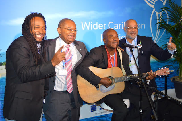 Dr. James Fletcher (second from left), with Jamaican artistes and the Director General of the OECS Commission Dr. Didacus Jules (far right) celebrate the success of the 1.5 to Stay Alive Campaign during the Paris Climate Talks. Courtesy: Dr. James Fletcher 
