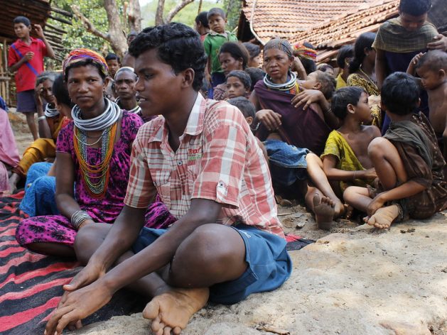 In this photo dated 2014, Buda Kirsani of the Bonda tribe tells IPS how he had to walk 12 kilometres across hill ranges, navigating steep hills to get to his classroom everyday. He dropped out in fifth grade and took admission in the local tribal residential school that the Odisha government opened for children like him. Current school closures because of coronavirus has sent thousands such disadvantaged children home uncertain if they will return to schooling anytime soon. Credit: Manipadma Jena/IPS