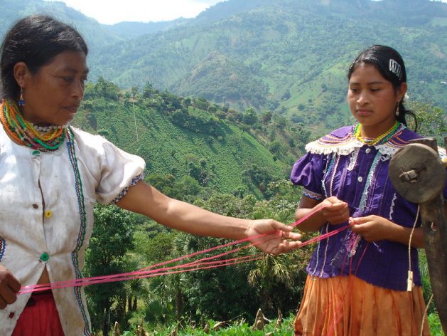A dated photo of indigenous women in Chiquimula in Guatemala making rope out of maguey (Agave americana) fibre. Experts say there is concern about whether there will be the protection and respect of indigenous peoples’ right to land and national resources as there will be huge interest in those resources during the post-COVID-19 recovery. Credit: Danilo Valladares/IPS