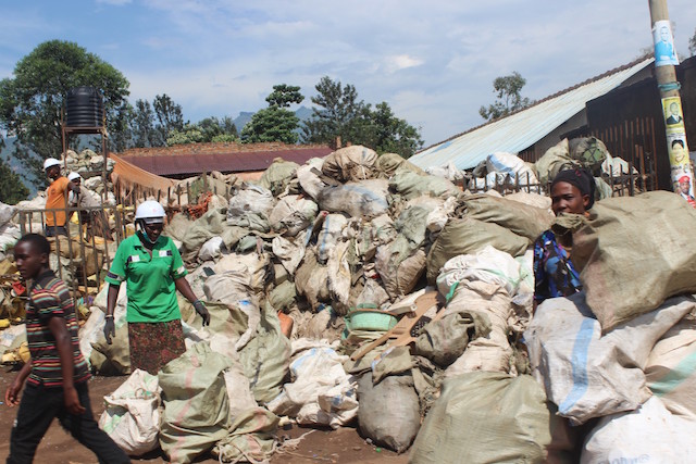 Women in eastern Uganda's Mbale city collect plastic waste for recycling. Proponents of upcycling say that in recycling waste one ends up polluting the environment. Credit: Wambi Michael/IPS 